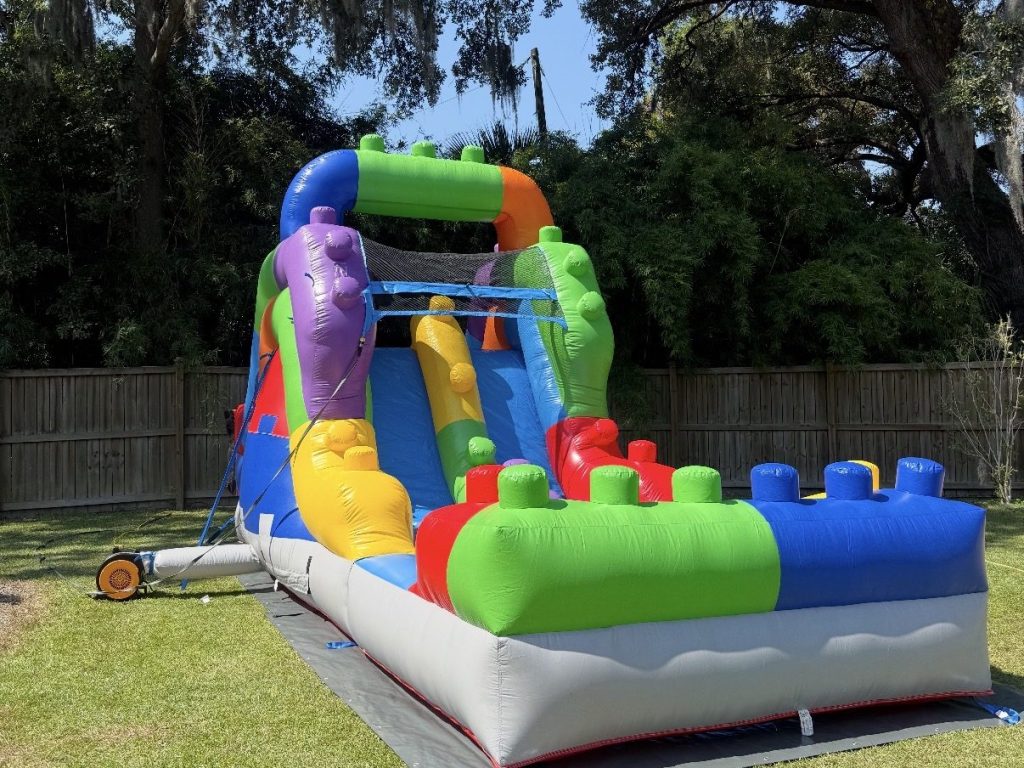 Inflatable slide set up in a Charleston-area backyard by Bouncy Rentals USA
